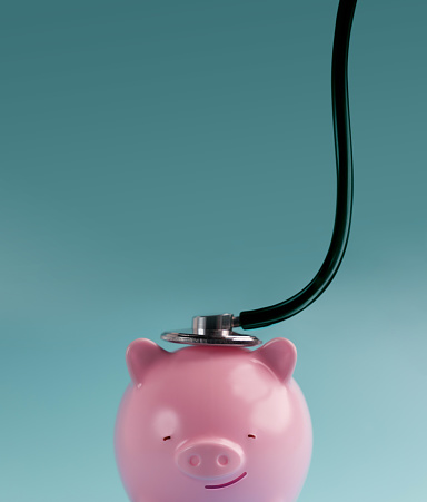 Finanacial Checkup, Review Concept. Meeting with a Financial Expert Doctor for Examination of Valuable Financial Assets, Money, Cost, Debts, Retirement Contributions. a Pink Chubby Smiling Piggy Bank with Stethoscope
