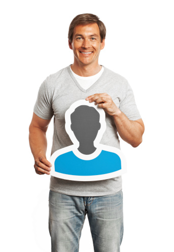 Smiling man holding profile image sign isolated on white background.  Image from 