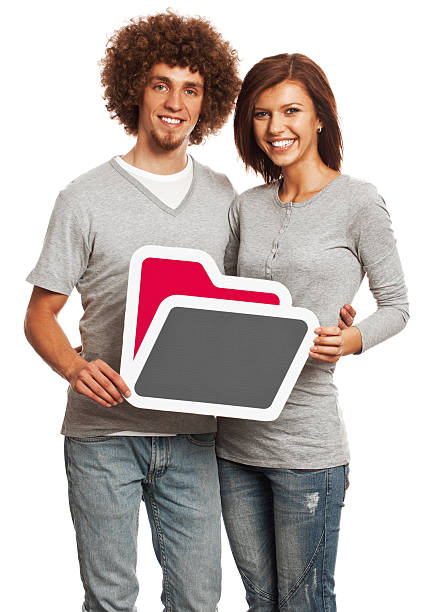 istock Smiling young couple holding folder sign isolated on white background. 170939172