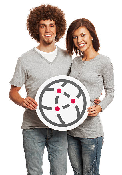 istock Smiling young couple holding network sign isolated on white background. 170939227