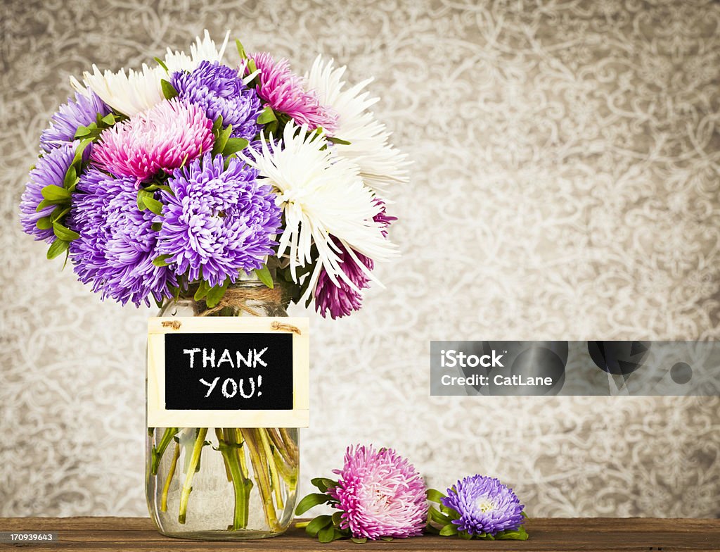 Flowers with Thank You Message Beautiful spring flowers with mini chalkboard thank you message Gratitude Stock Photo