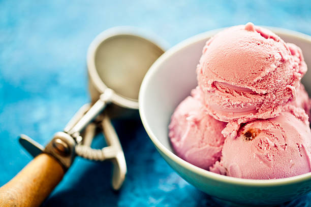 Ice Cream Delicious strawberry ice cream in a bowl. serving scoop photos stock pictures, royalty-free photos & images