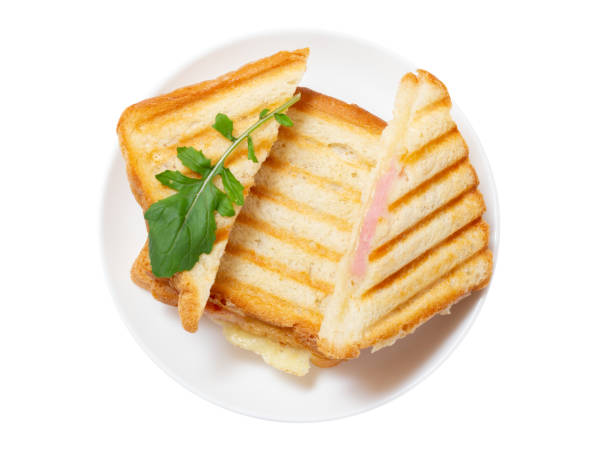 istock Homemade grilled cheese sandwiches for breakfast on white plate. 1709430574
