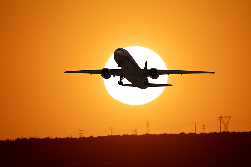 Airplane at the sunset