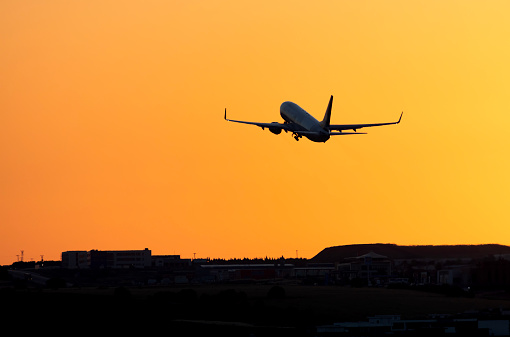 Logan International Airport, Boston Massachusetts, USA - October 2023.  Aircraft on the hard standing and the runway at the airport.