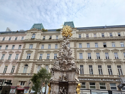 Vienna, Austria - June 8, 2023: View of the baroque memorial Plague Column, or Trinity Column, a Holy Trinity column located on Graben street, Vienna city.