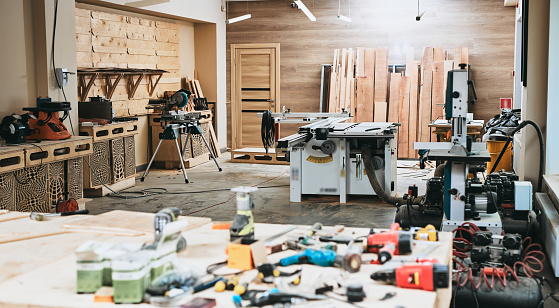 Carpentry workshop, furniture production manufactory, background with blur effect, no people