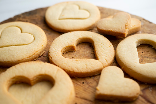 Preparing butter cookies for children with star and heart shapes..