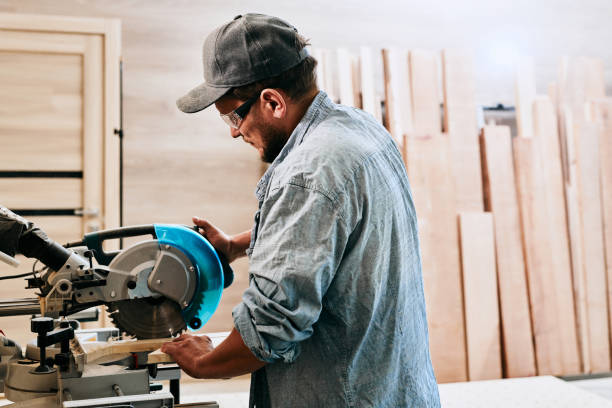 istock Carpenter works with wood in carpentry workshop. Man doing woodwork professionally 1709458990