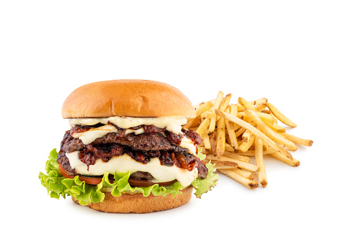 Classic hamburger with grilled and french fries on white background.