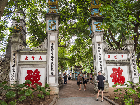 Entrance to the Ngoc Son Temple, located at the Hoan Kiem Lake in Hanoi's old quarter. You can reach the temple over the Welcoming Morning Sunlight Bridge. Hanoi, Vietnam - September 4, 2023.