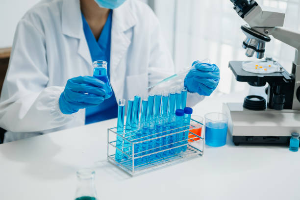 istock Modern medical research laboratory. female scientist working with micro pipettes analyzing biochemical samples, advanced science chemical laboratory 1709474902
