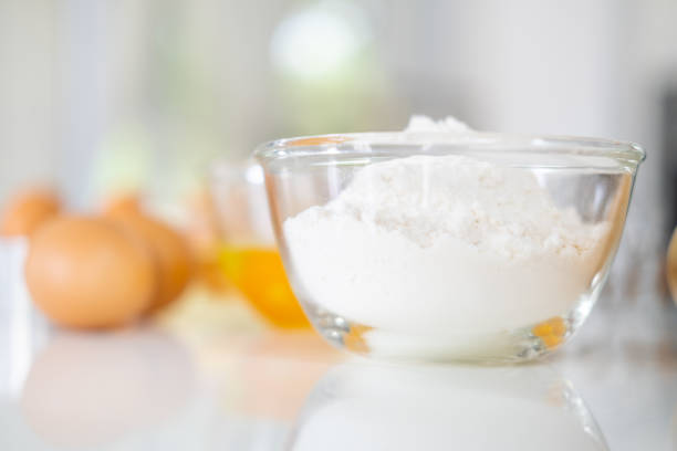 istock Fresh ingredients for delicious homemade cake on white  table and kitchen background. ingredients and tools to make a cake, flour, butter,eggs 1709493245