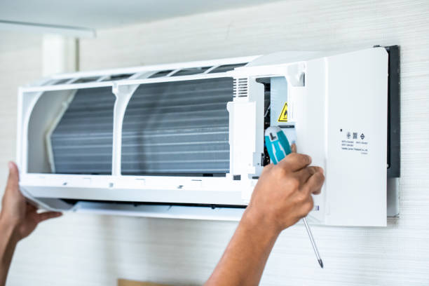 istock Selective focus to air conditioner with blurry screwdriver in hand of technician. 1709502016