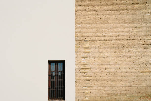 istock Background of a wall half white and half with bricks, divided into two halves. 1709516760