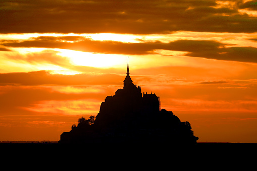 Breathtaking romantic View with Abbey of Mont Saint Michel in Normandy in France at sunset