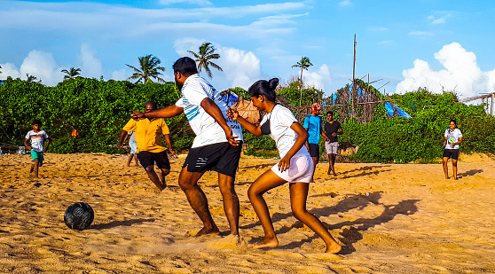 A game of football (soccer) at Candolim beach in Goa, India. The photo was shot on 27th September 2020, during the COVID-19 pandemic. Goa is known as a football crazy state.