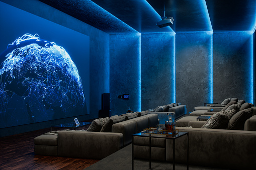 Interior of a luxurious private home cinema room, lit with neon blue lights. Features a big projection screen and cozy seats.\n(World Map texture credits to NASA: https://visibleearth.nasa.gov/view.php?id=55167)