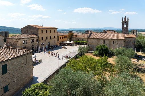 Monteriggioni,Italy-august 10, 2020:View of medieval village of Monteriggioni from above the walls during a sunny day