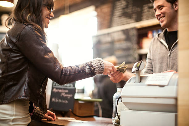 Young woman purchasing coffee