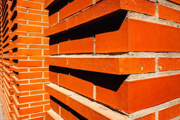 Red brick wall intense in the sun.
