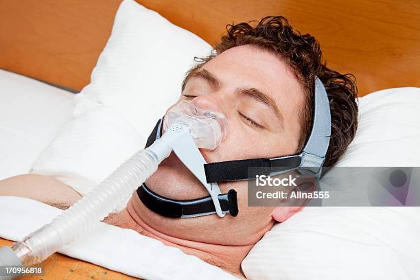 Man In His 30s With Sleep Apnea Sleeping Using Cpap Stock Photo - Download Image Now