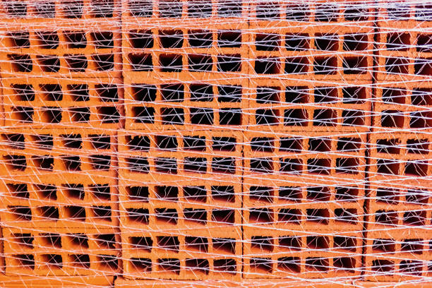 Close-up of a stack of packed bricks, to use as background in architectural themes.