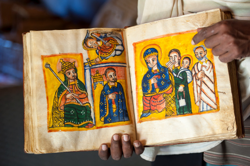An old, handwritten and handpainted book (approx. 13th - 14th century). The book is written in the ancient language Geez, which is not used anymore except as liturgical language of the Ethiopian Orthodox Tewahedo Church. 