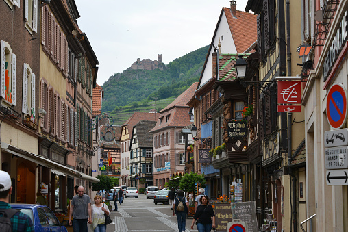 Ribeauville, France, 05-10-2022\ntraditional half timbered houses in narrow streets of old town Ribeauville in Alsace