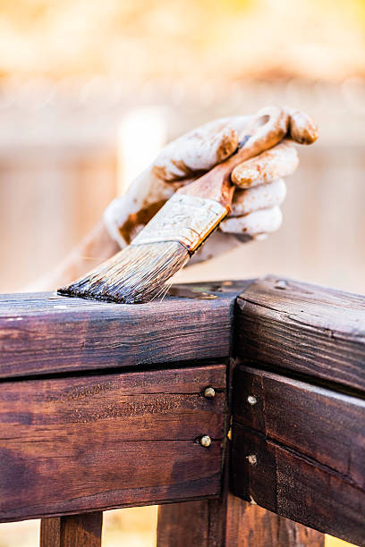 Staining a Deck for Winter Staining an outdoor deck for winter winterizing stock pictures, royalty-free photos & images