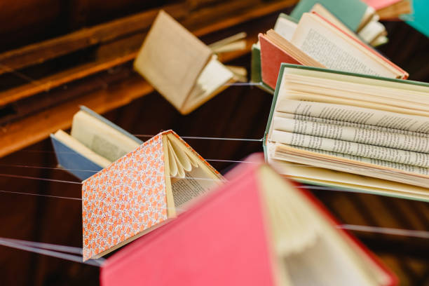 Old books hung with strings to encourage reading and learn about culture.