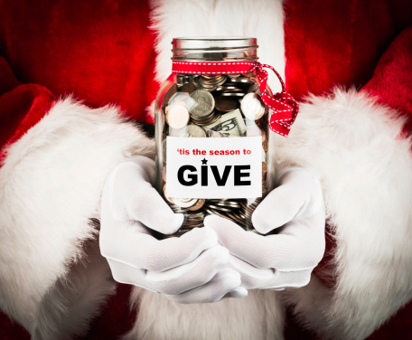 Santa with donation jar.