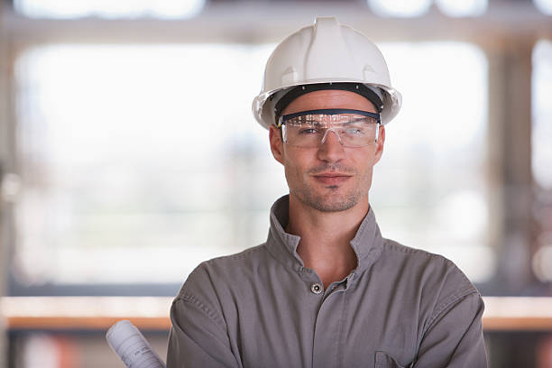 Construction worker on construction site  protective eyewear stock pictures, royalty-free photos & images