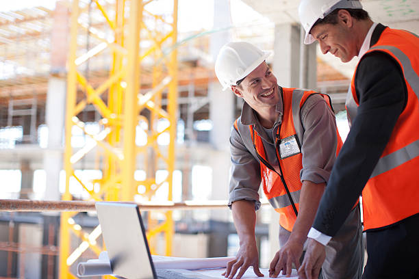 lean business plan construction example images Construction workers using laptop on construction site lean construction management stock pictures, royalty-free photos & images