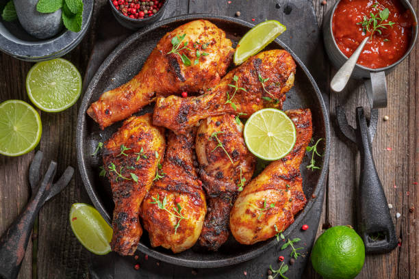 istock Spicy roasted chicken leg on metal grill. 1709622563