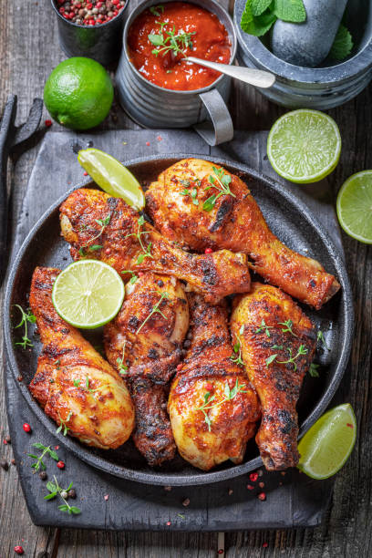 istock Hot roasted chicken leg on metal grill. 1709625347