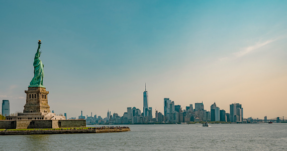Statue of Liberty on Liberty Island with New York City buildings skyline