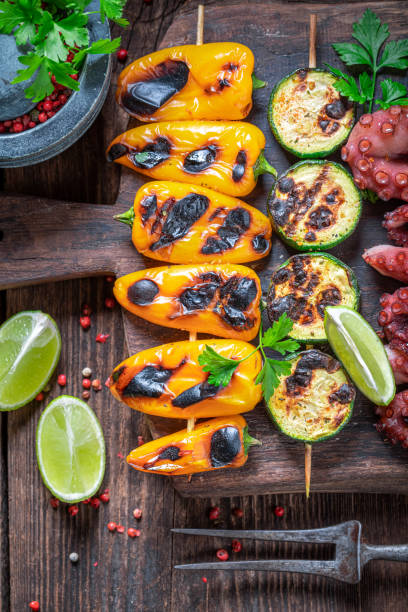 Hot grilled skewer with peppers, tomatoes and zucchini.