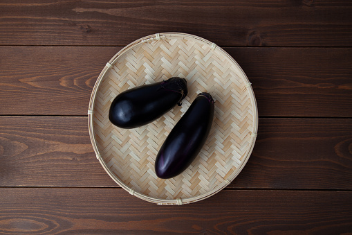 eggplant aubergine isolated on wooden table