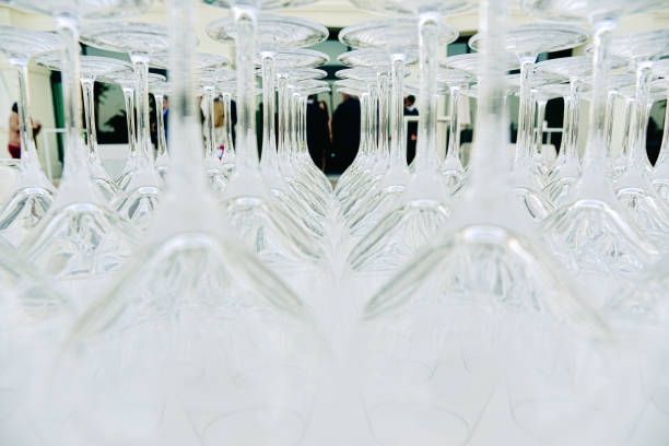 Background of transparent glasses and cups, empty and clean, prepared by a catering for drinks and celebrate an event with diners.