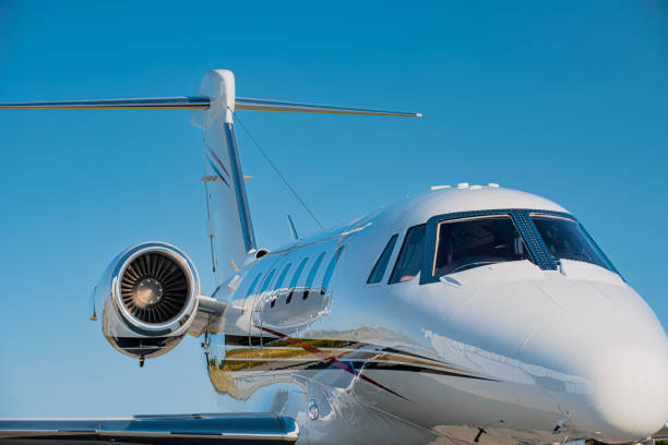 Small corporate jet as seen from the side Small corporate jet as seen from the side. The fuselage, wings, tailfin and the jet engine are visible. The aircraft is set against a clear blue sky. fuselage stock pictures, royalty-free photos & images