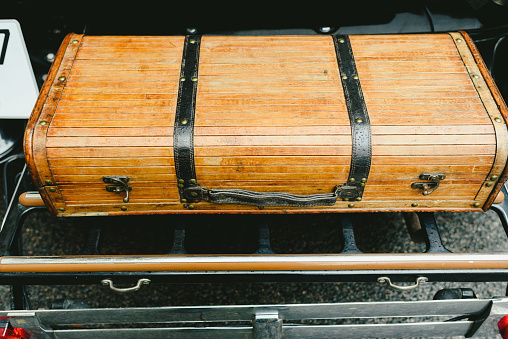 Wooden suitcase of an old vintage car.