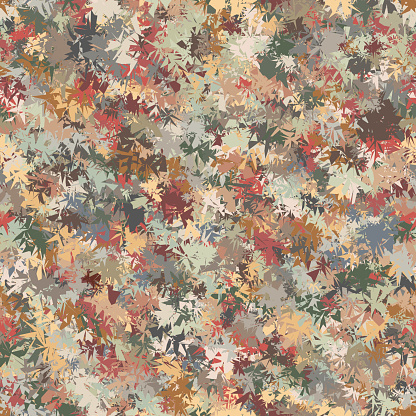 Abstract autumn grass. Spotted design in camouflage style. Seamless repeating pattern with jagged edge irregular geometric elements in different shades of green and brown. Vector image.