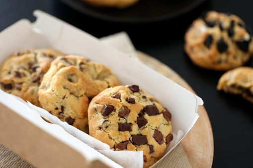 Freshly baked homemade cookies with chocolade chips on baking tray