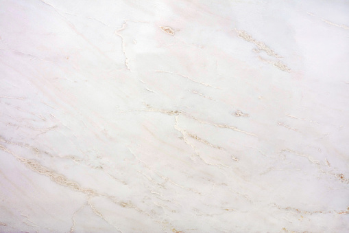 Large format texture, unique cream quartzite with a layered structure, light uniform surface.
