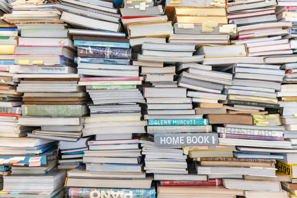 istock Bangkok,Thailand - 29 June 2023: wall of book stack pile 1709776609