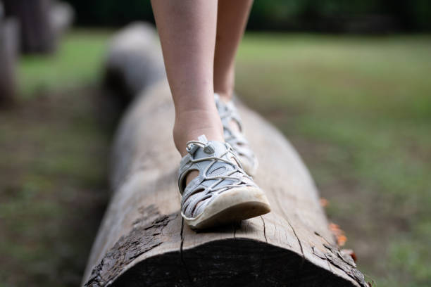istock child's feet walking on a log 1709808855