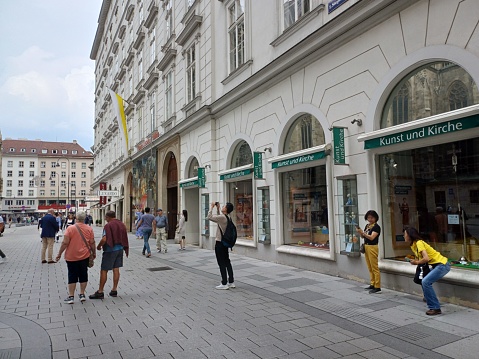 Vienna, Austria - June 8, 2023: Street view in center of Vienna city with buildings, tourist, store. Street life in capital of Austria.