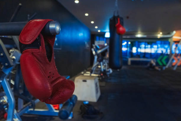 istock Boxing glove, weight training exercising equipment in gym 1709858004