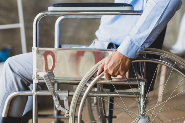 istock Man sitting in wheelchair at home. 1709868129